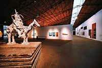 a statue of a camel in a museum