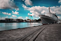 a large cruise ship docked at a dock