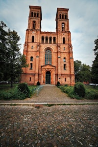 a large brick building with two towers