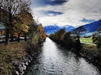 a river with mountains in the background