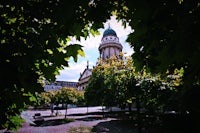 a building with a clock tower in the background