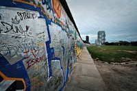 a wall covered in graffiti