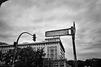 a street sign on a pole in front of a building