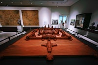 a wooden model of a building in a museum