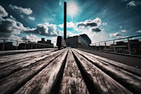 a wooden bench in the middle of a city