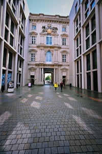 a large building with a clock in the middle of it