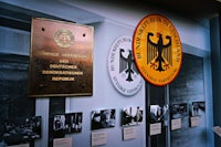 a plaque is displayed on a wall in a museum