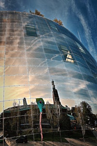 a building is reflected in a mirror