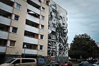 a black and white mural on a building