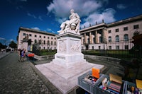 a statue of a man in front of a building