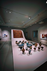 a display of vases in a museum