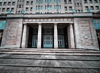 a large building with pillars in front of it