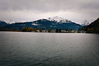 a lake with mountains in the background