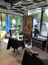 a black chair in a room with a window