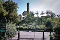 a tall tower on top of a hill
