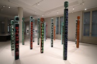 a group of colorful poles in a room